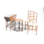 Four items of furniture To include an oval oak drop leaf table on turned supports,