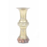 A Chinese polished bronze Gu vase,