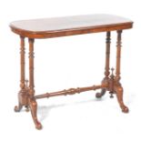 A Victorian walnut occasional table The rectangular moulded top with rounded corners supported on