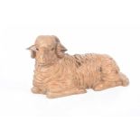 A large carved wood model of a ram, 20th century Seated ram, fitted with glass eyes, length 50cm,