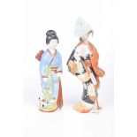 Two Japanese painted porcelain figures, 20th century Each dressed in robes and kimono,