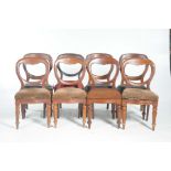 A set of eight matched Victorian mahogany balloon back dining chairs The majority with Serpentine