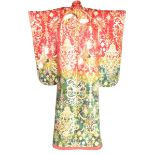 A Japanese embroidered kimono, 20th Century The faded red to green robe,