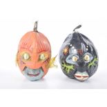 Two Caribbean made painted coconut heads,