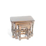 An oak Priory style nest of three tables The rectangular tops supported on block and turned