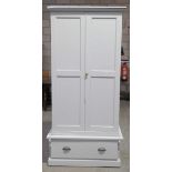 A Victorian painted pine wardrobe With two panelled doors enclosing a vacant interior above a