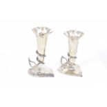 A pair of silver plated trumpet shaped bud vases Each tapering vase held within a openwork