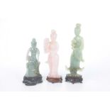 A collection of Chinese green hard stone and quartz figures of Guanyin The two green carved