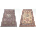 A Kashan style prayer rug The magenta and cream ground rug, detailed with geometric borders,