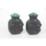 A pair of Chinese black glass perfume bottles,