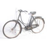 A vintage ladies bicycle The downswept tubular frame with an impressed registration number 2366 and