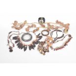 A Collection of African tribal jewellery To include a white metal bangle,
