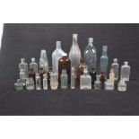 A selection of old pharmaceutical and domestic bottles To include bottle with paper label 'genuine
