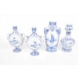 Four items of mid 20th Century blue and white Delft ware To include a pair of two handled moon