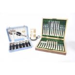A cased set of twelve tea knives and forks Within a walnut box each applied with a silver collar