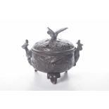 A Japanese bronze Koro and cover The tripod base, cast with phoenix and foliate designs,