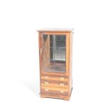 The hardwood display cabinet by Mike Brown and Muller Having a single leaded glazed door enclosing