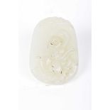 A Chinese green hard stone carved pebble pendant The oval shaped panel,