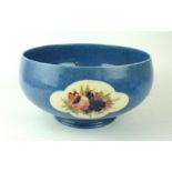 A William Moorcroft pedestal bowl Decorated in with 'Roses and Fruit' on a powder blue ground,