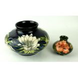 A modern Moorcroft pottery squat vase Decorated in the "Queen of the Night" pattern,