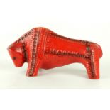 A Bitossi style red glazed bull Having impressed stylised decoration, height 19cm,