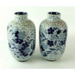 A pair of Doulton Lambeth stoneware vases Each having incised and relief floral decoration,