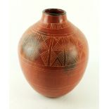 Siddig El Nigoumi (1931-1996) burnished clay vase Of bulbous form, having incised decoration,