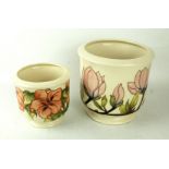 Two Moorcroft pottery jardinieres Comprising an example decorated in the Magnolia pattern on an