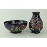 Two pieces of Moorcroft pottery Each decorated in the 'Anemone' pattern on a blue ground,