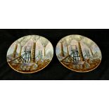 A pair of Cobridge Stoneware limited edition circular wall chargers Each decorated with factory