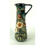 A modern Moorcroft pottery limited edition jug of slender form Decorated with stylised foliate on a