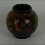 A Walter Moorcroft vase of bulbous form Decorated in the Clematis pattern on a flambe ground,