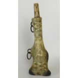 A fine quality antique carved and extensively decorated Germanic shin bone powder flask Extensively