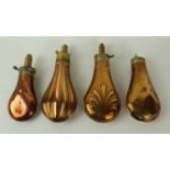 Four copper and brass powder flasks mid 19th Century First of fluted decoration stamped J W