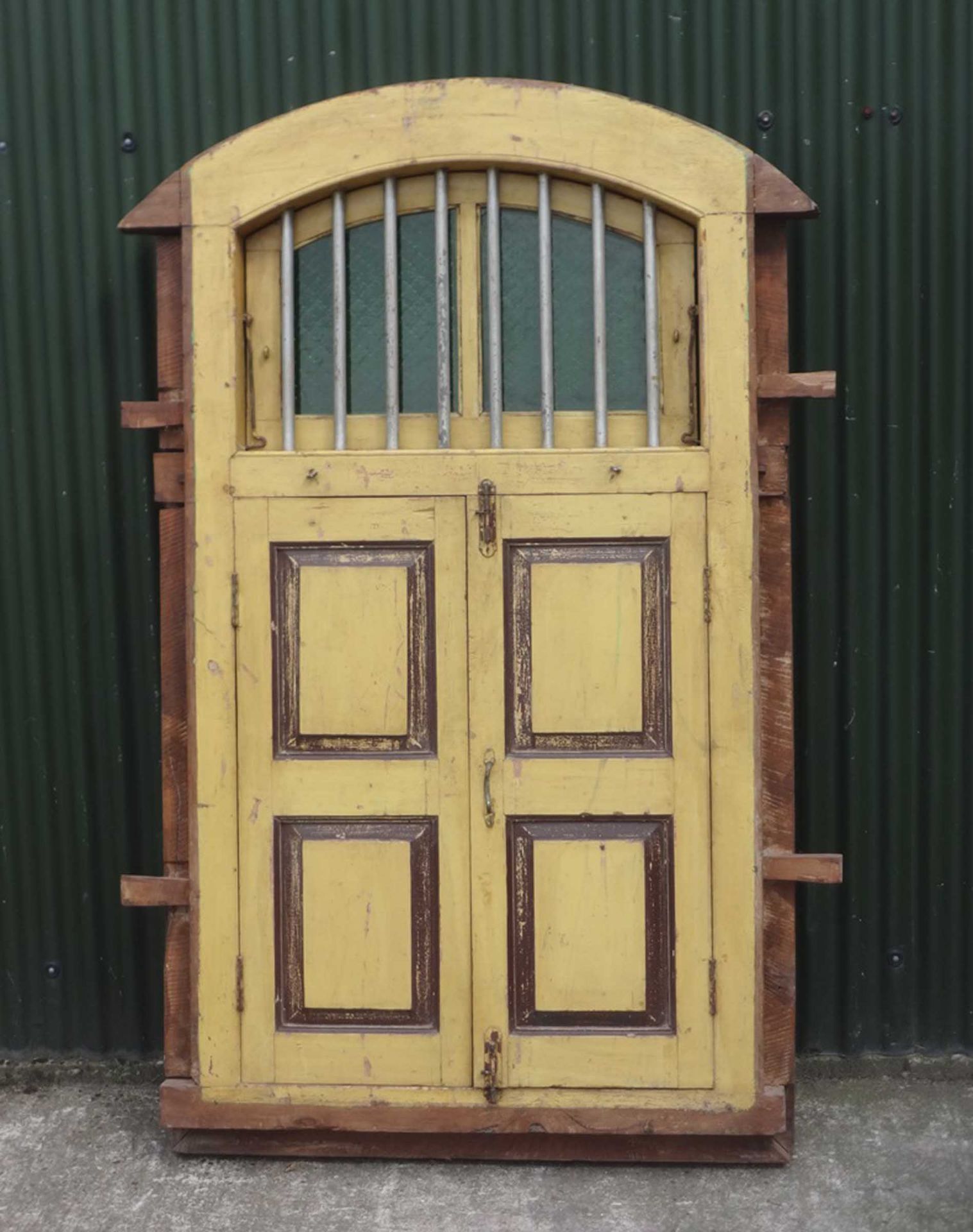 Glazed set yellow wooden window shutters.