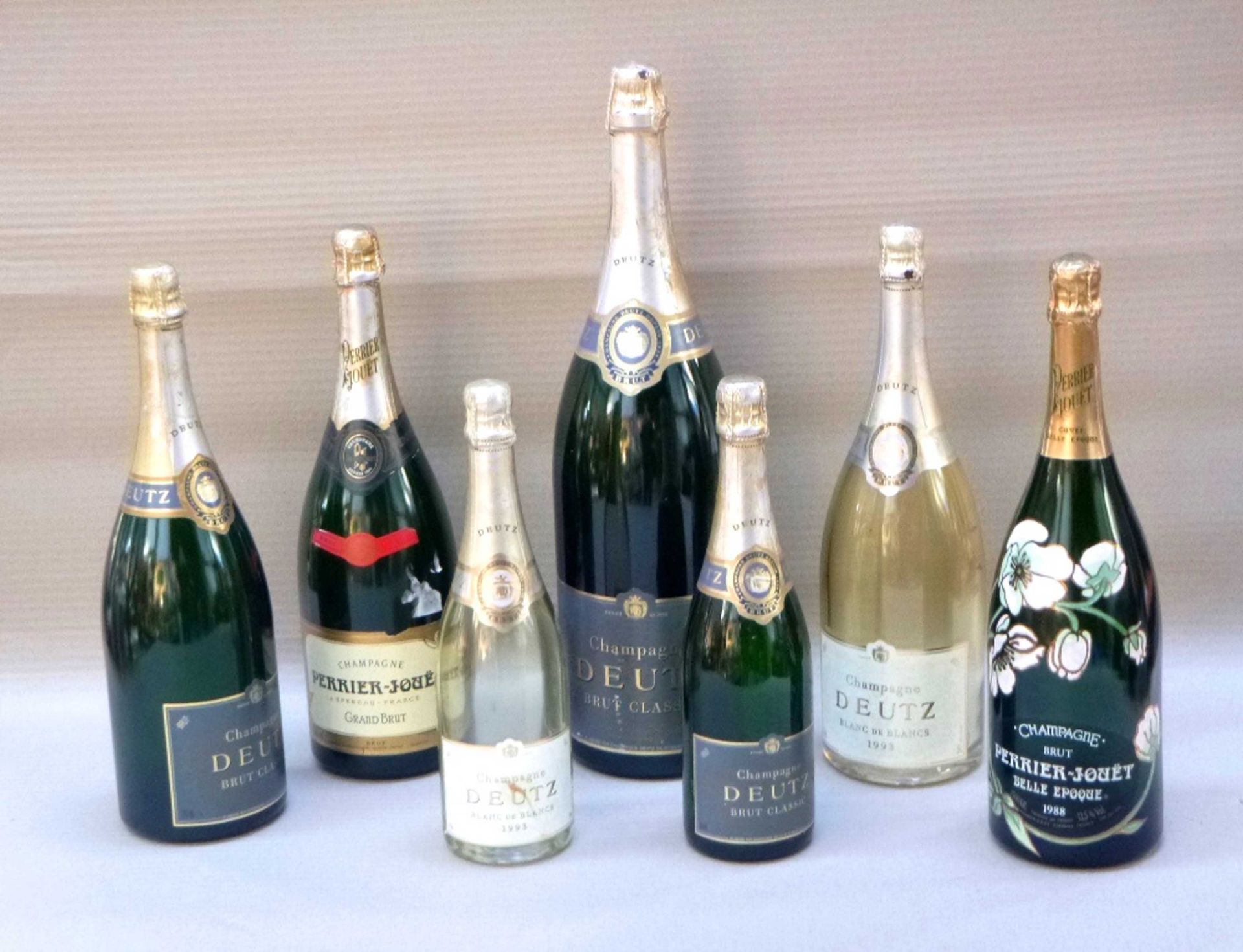 Collection of seven champagne bottles.