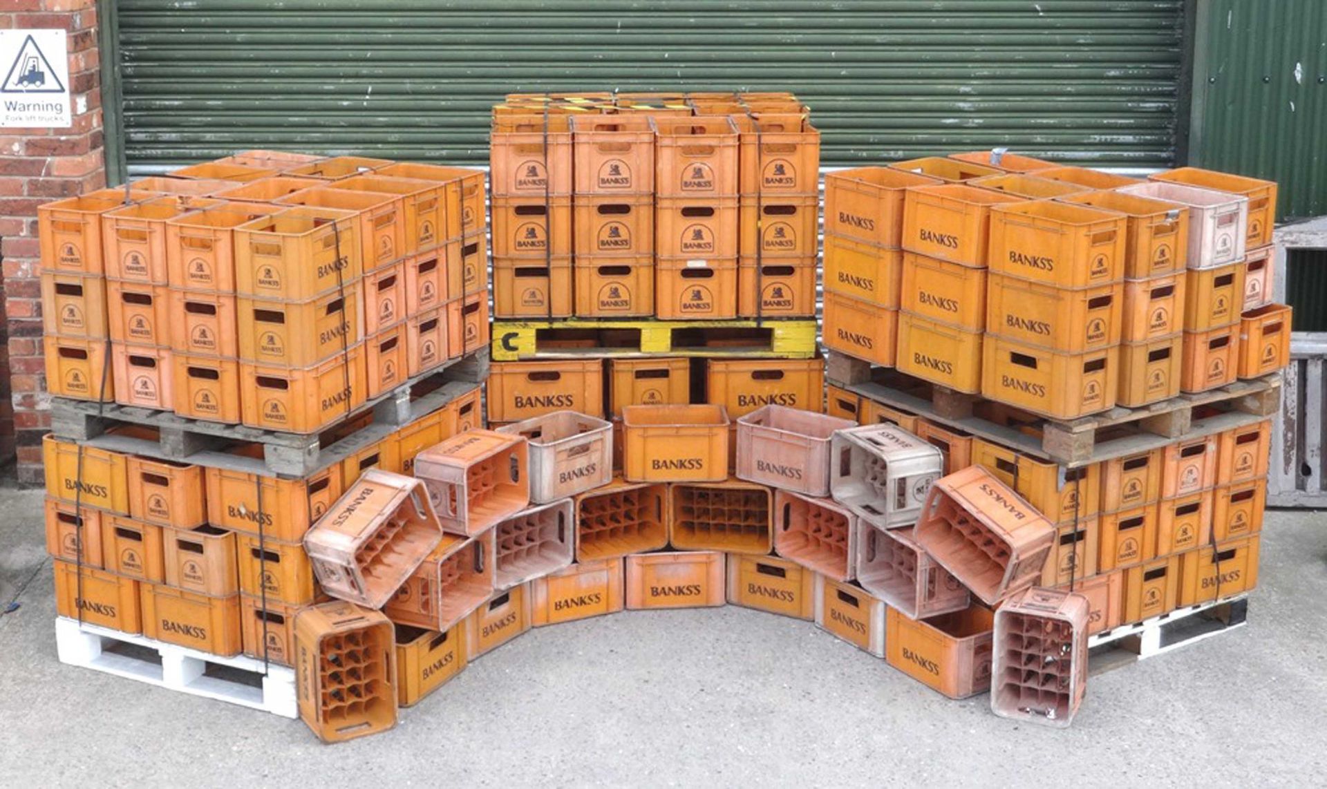 A quantity of twelve 'Banks' orange beer crates, 26x36x27cm.