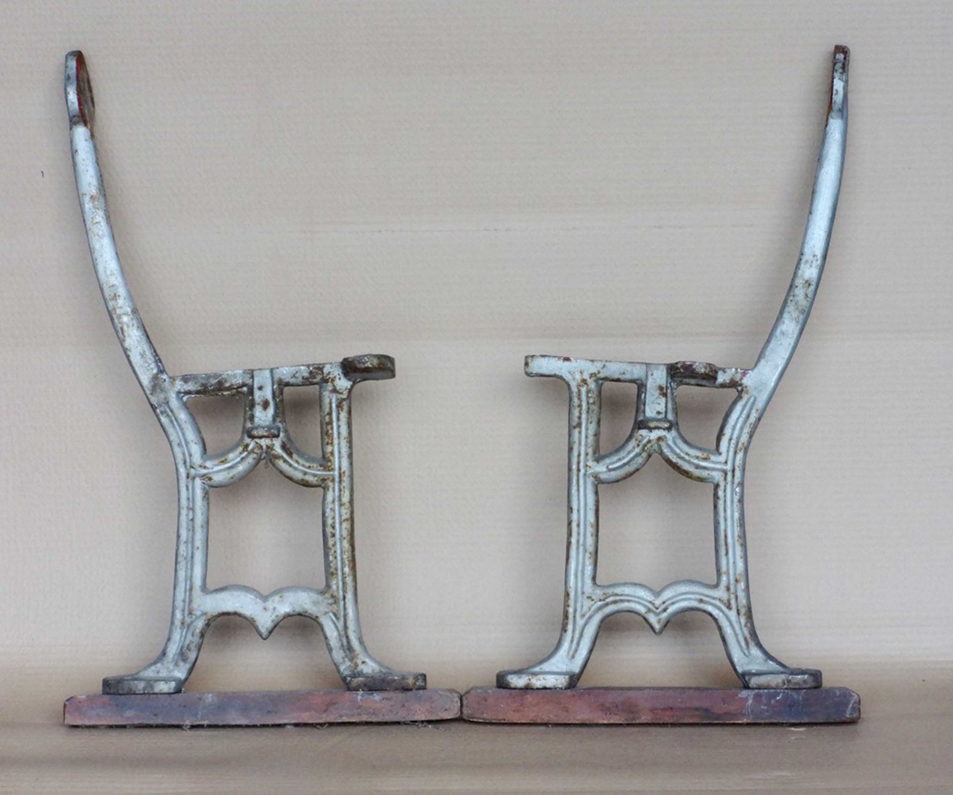 Pair of cast iron bench ends.