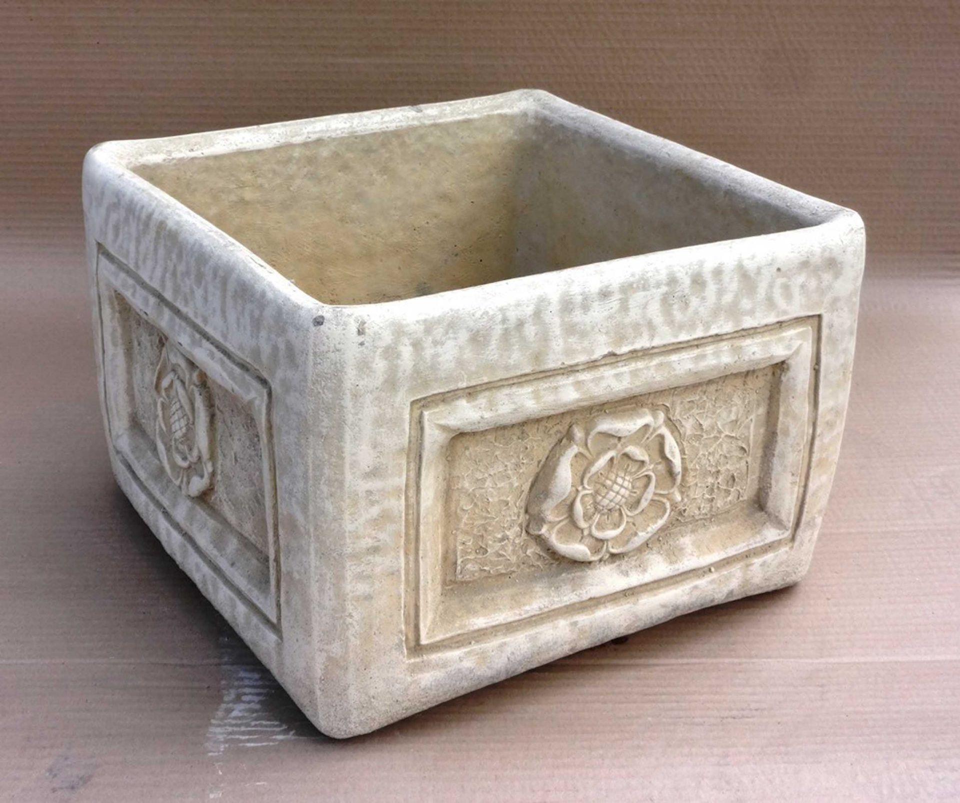 Stone square rose planter.