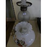 A 20th Century electric table lamp formed of parts from various oil lamps (sold electrically
