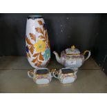 A Sadler three piece tea set together with a Dutch Haarlem floral decorated vase