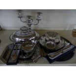 A collection of various silver-plated items to include covered entree dish, candelabra,