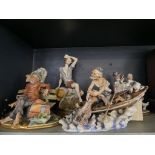 A collection of four Capodimonte and similar figure groups CONDITION REPORT: Figure