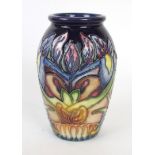 A modern Moorcroft pottery limited edition vase of cylindrical form Decorated in the Geneva pattern,