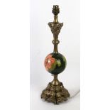 A Walter Moorcroft table lamp With circular ceramic centre decorated in the Hibiscus pattern,