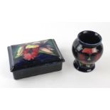 Two pieces of Walter Moorcroft To include a lidded trinket box decorated in the Orchid pattern on