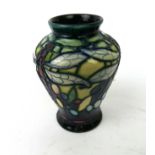 A Moorcroft pottery vase of shouldered form Decorated in the Favrile pattern,