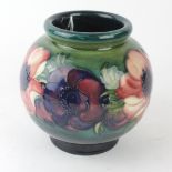 A Walter Moorcroft pottery vase of bulbous form Decorated in the Anemone pattern on a green/blue