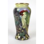 A Moorcroft enamel limited edition vase of tapering form Decorated in the Green Woodpecker pattern,