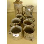 A 20th Century Irish studio pottery coffee set decorated with abstract detail on a stoneware base.